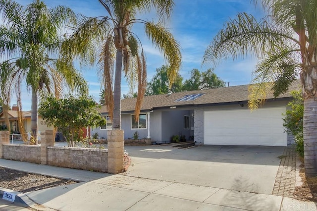 ranch-style house featuring a garage