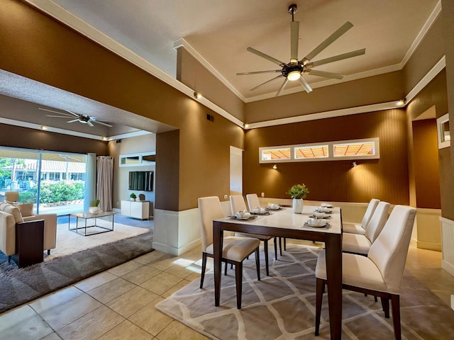 dining area featuring light tile patterned floors, ceiling fan, and ornamental molding