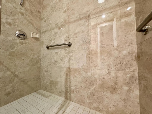 bathroom with a tile shower