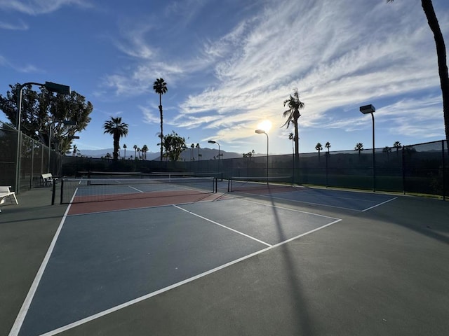 view of sport court featuring basketball hoop