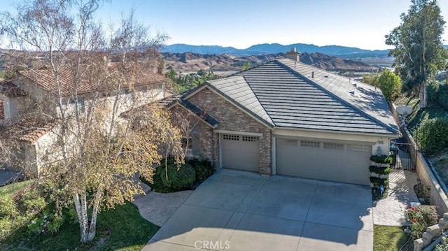 view of front of house featuring a mountain view and a garage