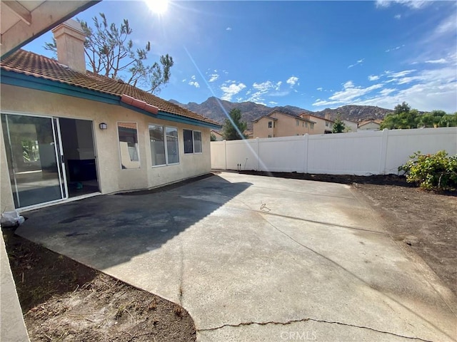 view of patio with a mountain view