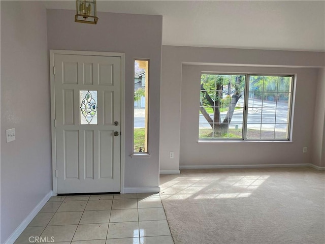 entryway with light tile patterned flooring