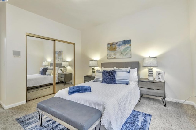 bedroom featuring light carpet and a closet