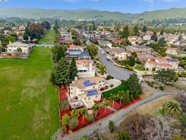 birds eye view of property with a mountain view