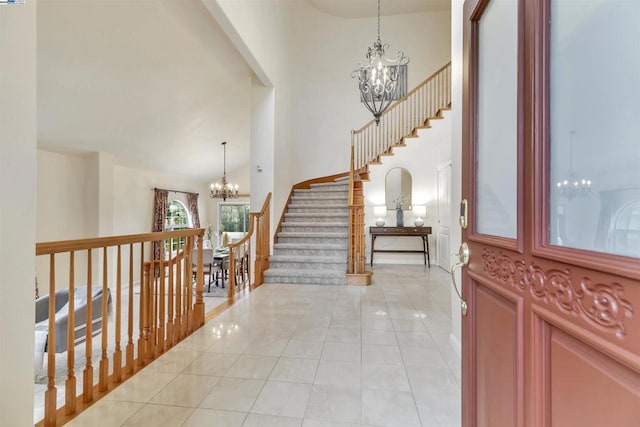 tiled foyer entrance with a notable chandelier