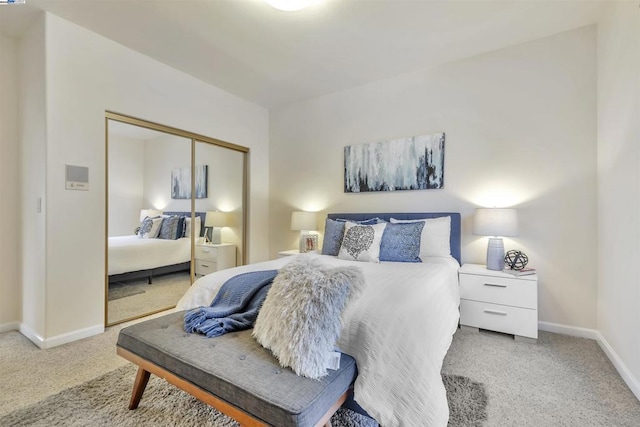 carpeted bedroom with a closet