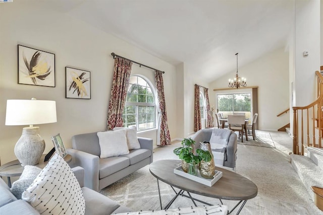 carpeted living room featuring an inviting chandelier and vaulted ceiling