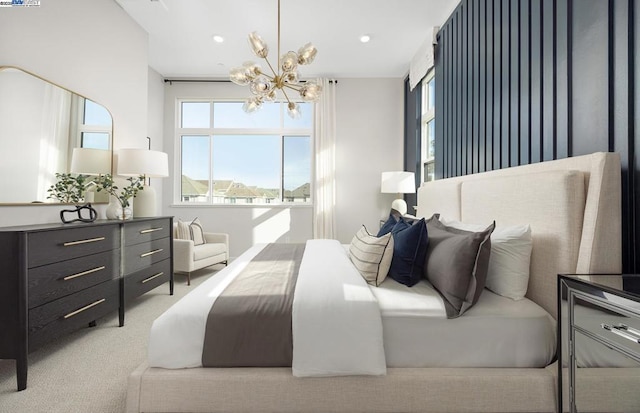 carpeted bedroom featuring a chandelier