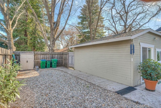 view of yard with a patio area and a storage shed