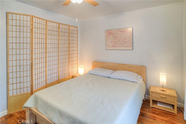 bedroom featuring ceiling fan and hardwood / wood-style floors