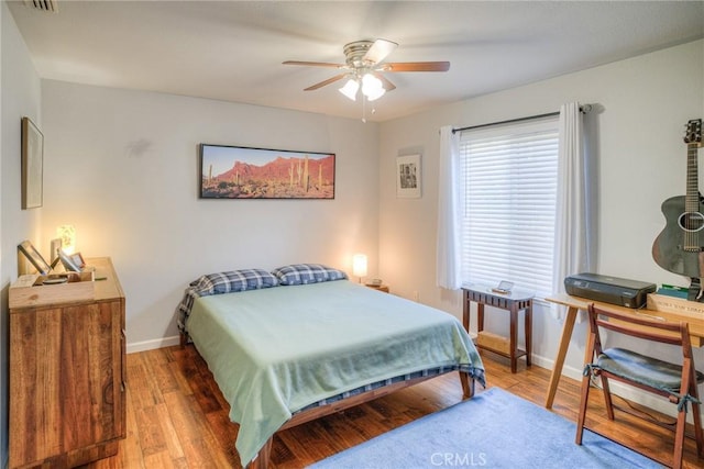 bedroom featuring ceiling fan and wood-type flooring