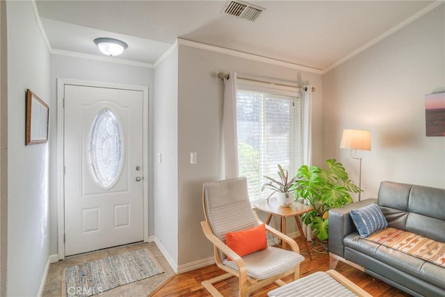 entrance foyer featuring wood-type flooring and crown molding