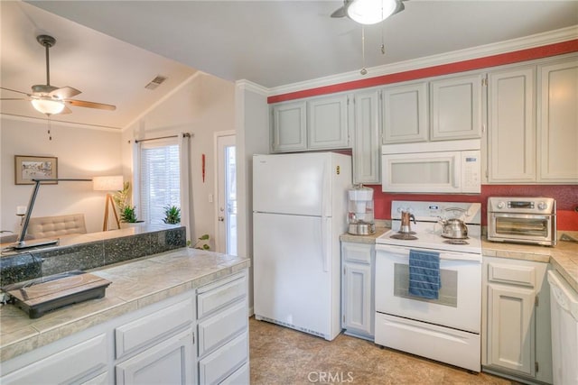 kitchen with vaulted ceiling, ceiling fan, ornamental molding, and white appliances