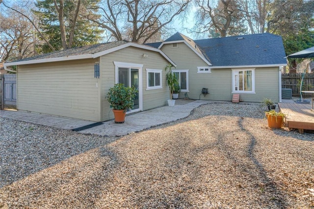 back of property with a patio