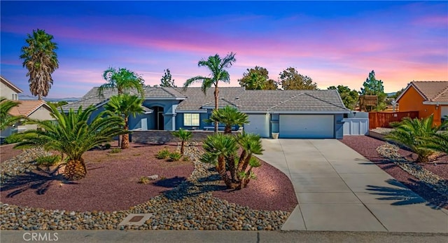 single story home featuring a garage