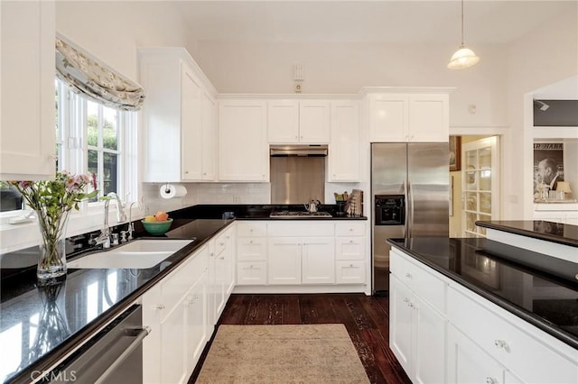 kitchen with sink, stainless steel appliances, and white cabinetry