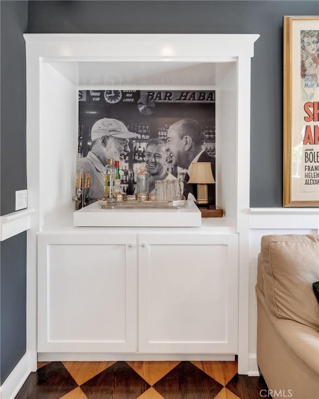 bar featuring white cabinetry