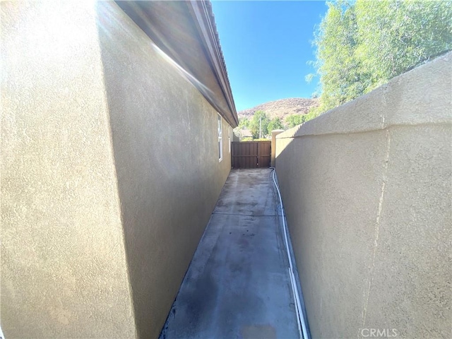 view of property exterior featuring a mountain view