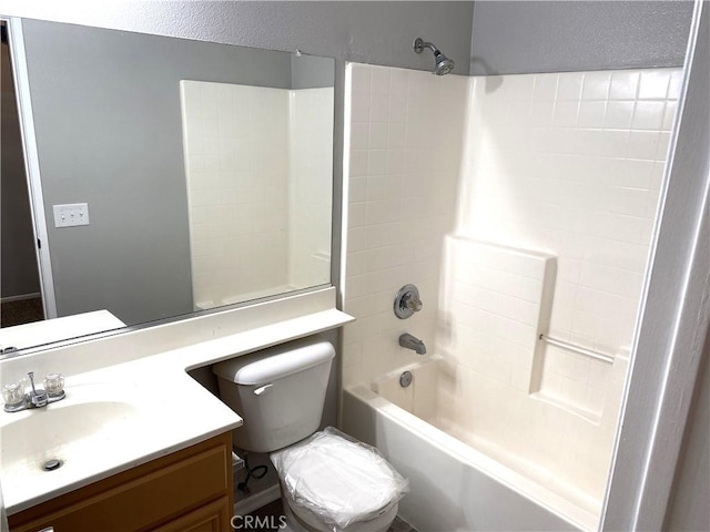 full bathroom featuring tub / shower combination, toilet, and vanity