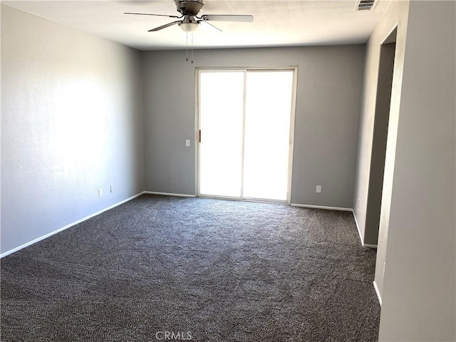 carpeted empty room featuring ceiling fan