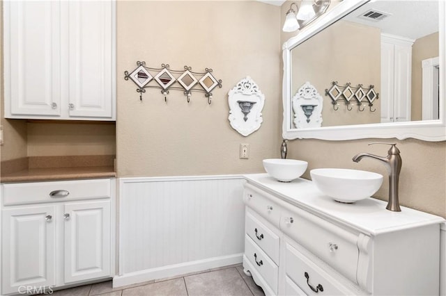 bathroom featuring vanity and tile patterned flooring