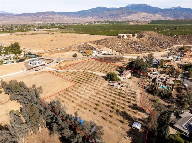 bird's eye view featuring a rural view and a mountain view