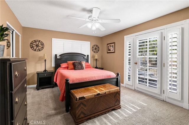 carpeted bedroom featuring ceiling fan and access to outside