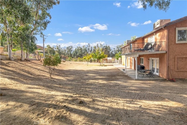 view of yard with a patio area and central AC