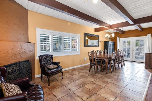 tiled dining space with french doors, beam ceiling, and a notable chandelier