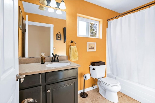 bathroom featuring tile patterned floors, vanity, and toilet