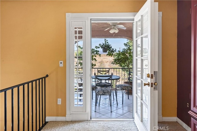 doorway with french doors, ceiling fan, carpet, and plenty of natural light