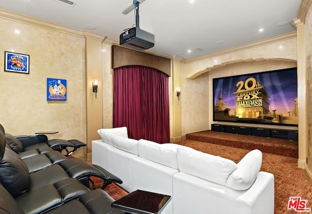 carpeted cinema featuring ornamental molding