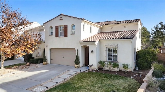 mediterranean / spanish-style house with a garage