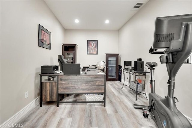 office area with light hardwood / wood-style floors