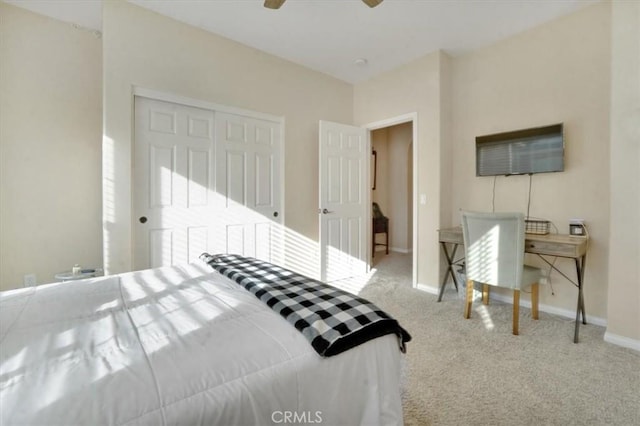 bedroom featuring carpet, a closet, and ceiling fan