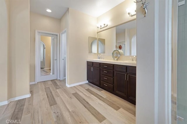 bathroom featuring wood-type flooring and vanity