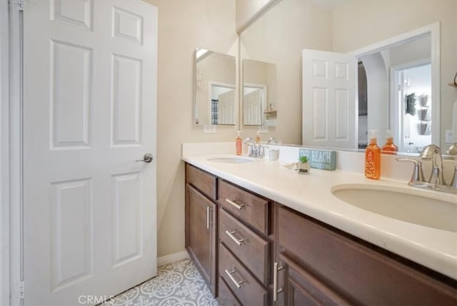 bathroom featuring tile patterned flooring and vanity