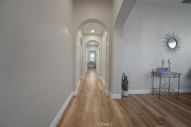 corridor featuring light hardwood / wood-style flooring