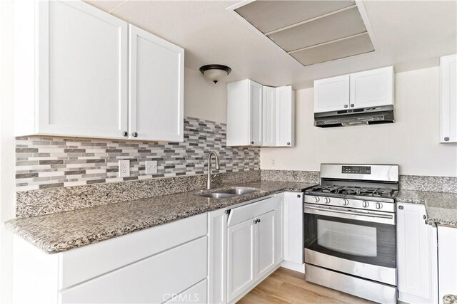 kitchen featuring white cabinets and stainless steel gas range