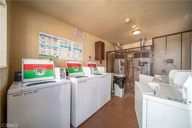 laundry room featuring washing machine and clothes dryer