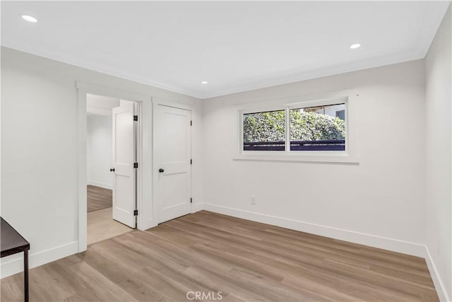 spare room featuring light hardwood / wood-style floors