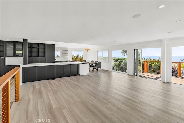 kitchen featuring light hardwood / wood-style floors and an inviting chandelier