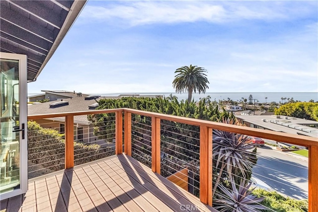 wooden deck with a water view