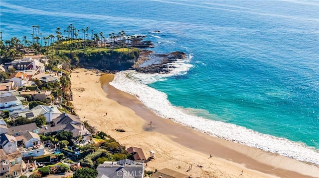 bird's eye view featuring a view of the beach and a water view