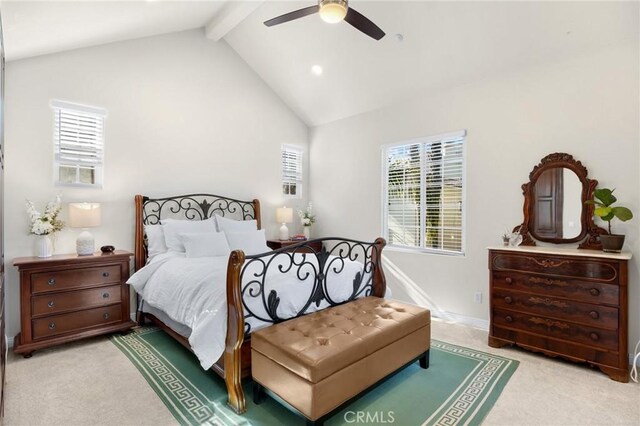 carpeted bedroom with ceiling fan and vaulted ceiling with beams