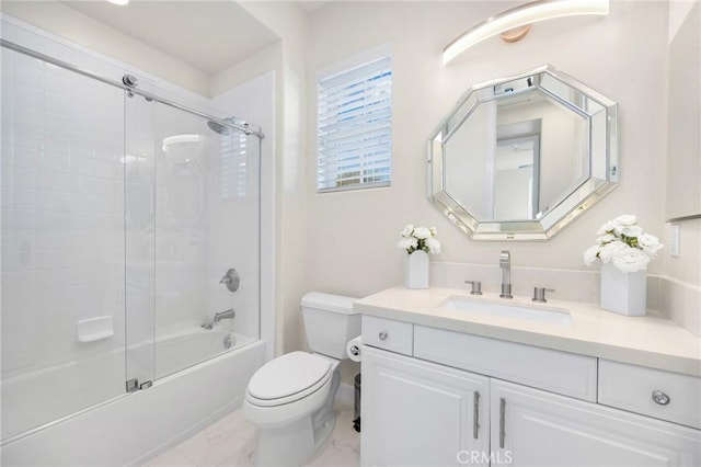 full bathroom with shower / bath combination with glass door, vanity, and toilet