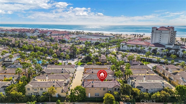 aerial view with a water view and a view of the beach