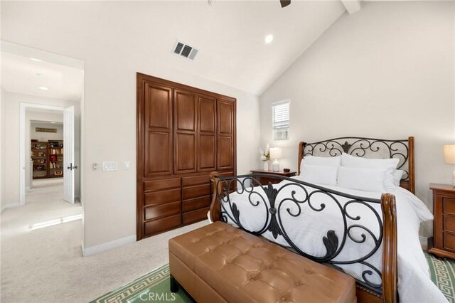 carpeted bedroom featuring high vaulted ceiling and ceiling fan