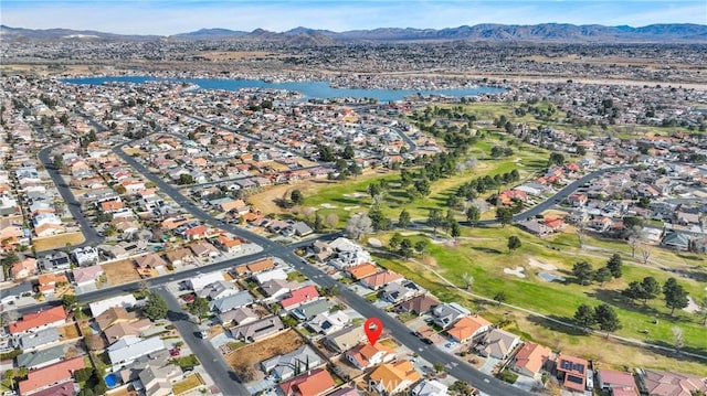 birds eye view of property featuring a water and mountain view